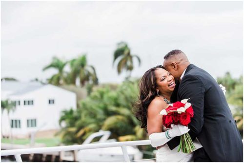 Bride with red bouquet South Florida Wedding