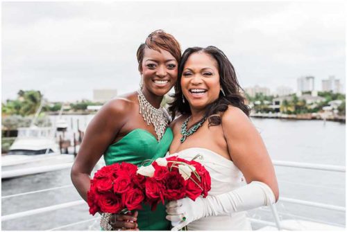 Bride and daugher with red flowers South Florida Wedding