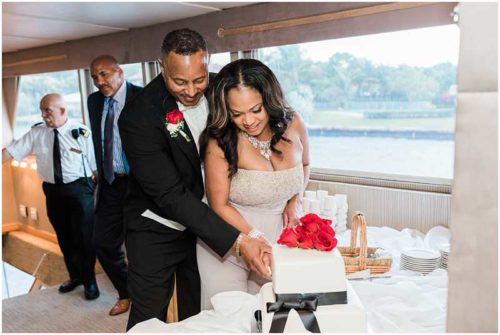 Bride and groom cutting cake