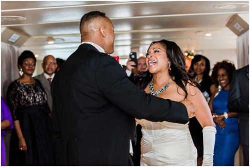 Bride singing to groom on yacht