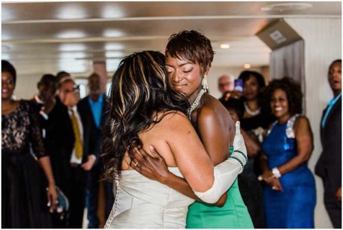 Bride and daughter hug