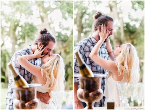 Kissing in front of champagne at Up the Creek Farms engagement