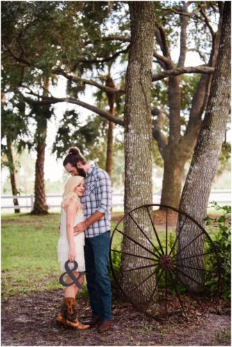 Couple under tree at Up the Creek Farms engagement