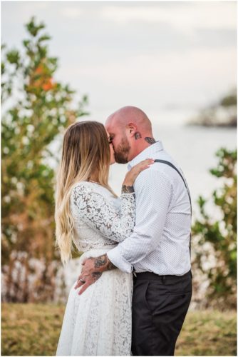 First kiss at Chart House waterfront wedding