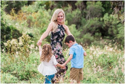 Melbourne family photographer with Mom dancing in circle with kids photo by Liz Cowie Photography