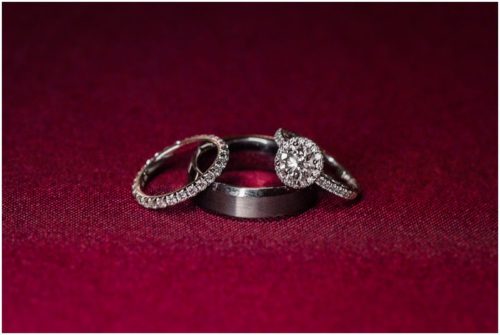 wedding rings on red cloth at waterfront wedding at Chart House