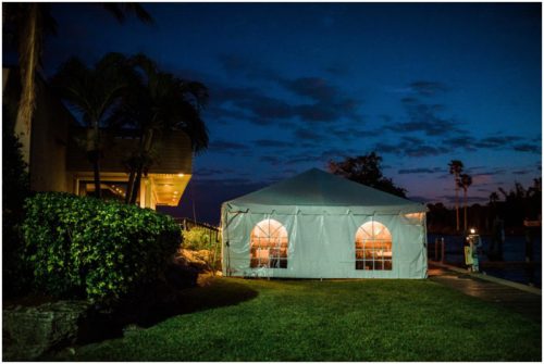 Nightime tent setup at waterfront wedding at Chart House
