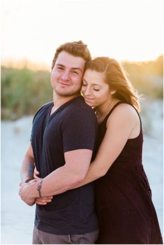 Couple hugging at Jetty Park Engagement