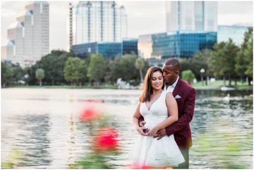 Couple in front of Lake Eola during engagement