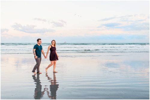 Walking down the beach at sunset at Jetty Park Engagement
