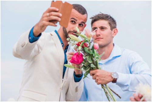 Groom with friend taking a selfie
