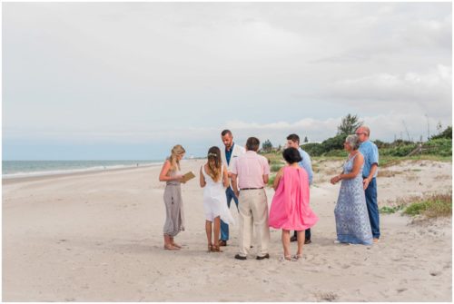 Ceremony on beach Bride and groom at beach elopement at Windemere by the Sea