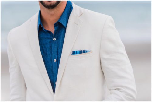 Close up of grooms jacket Bride and groom at beach elopement at Windemere by the Sea