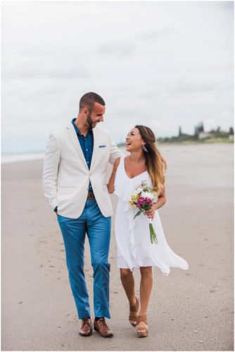 Happy couple at beach elopement at Windemere by the Sea