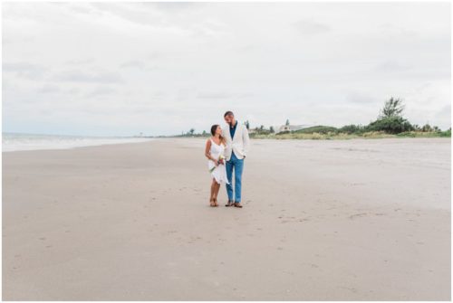 Bride and groom on beach at beach elopement at Windemere by the Sea