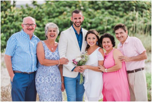 The whole family laughing at beach elopement at Windemere by the Sea