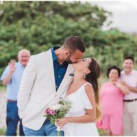 Bride and groom kissing at beach elopement at Windemere by the Sea