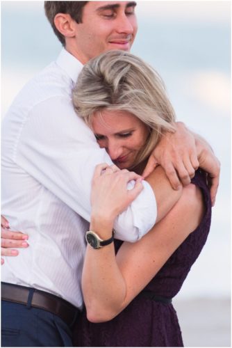 Couple hugging on beach at Melbourne Beach Proposal