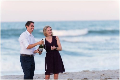 couple popping champagne on beach at Melbourne Beach Proposal