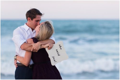 Groom holding sign Melbourne Beach Proposal