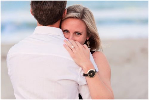 Bride looking over shoulder at beach during Melbourne Beach Proposal