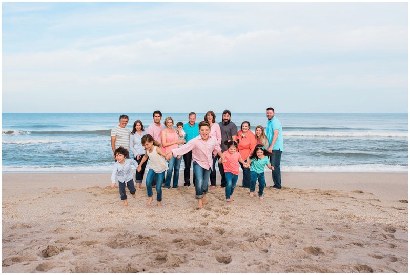 Family running on beach during Melbourne Beach Family Portraits