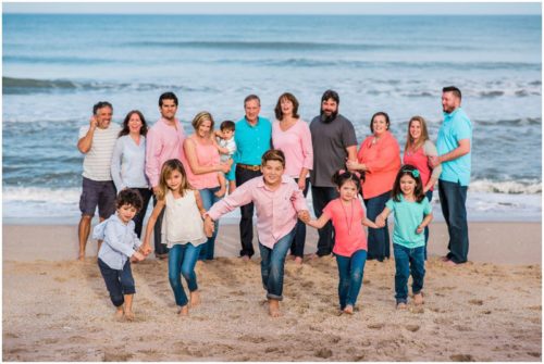 family running on beach at Melbourne Beach family portrait session