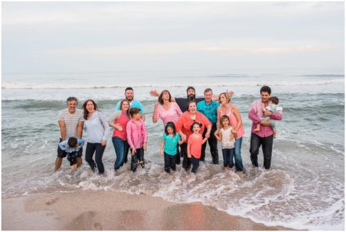 wave crashing on family at Melbourne Beach family portrait session