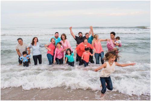 wave crashing on family at Melbourne Beach family portrait session