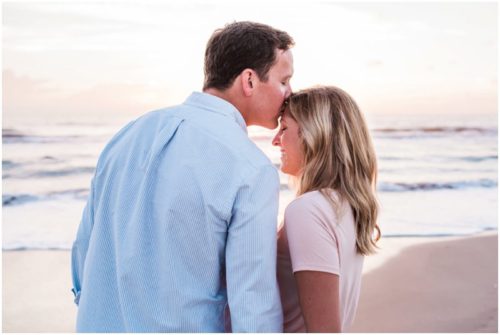 Man kissing forward during sunrise engagement on Melbourne Beach