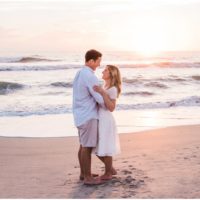 couple looking at each during sunrise engagement on Melbourne Beach