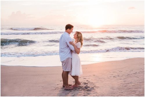 couple looking at each during sunrise engagement on Melbourne Beach