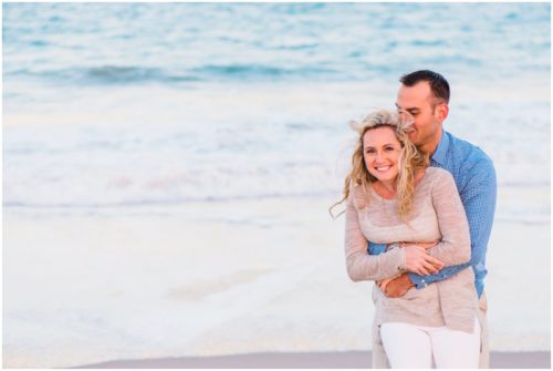 hugging by water at Vero Beach Engagement