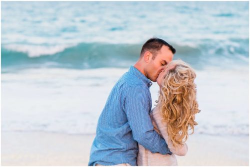 kissing by water at Vero Beach Engagement