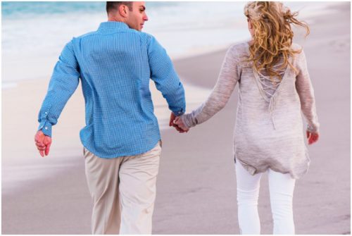 Holding hands on beach at Vero Beach Engagement