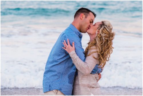 couple kissing in front of ocean at Vero Beach Engagement