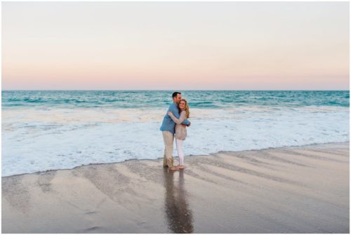 couple hugging in water at Vero Beach Engagement