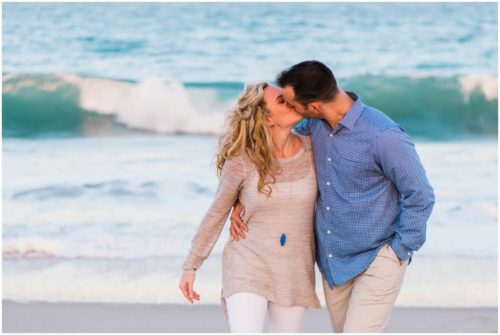 kissing by water at Vero Beach Engagement