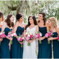 Outdoor wedding with bridesmaids in blue