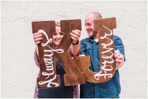 Couple holding wood letters t Melbourne engagement photography session