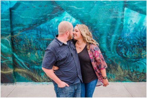 Couple walking with blue wall at downtown Melbourne engagement photography session