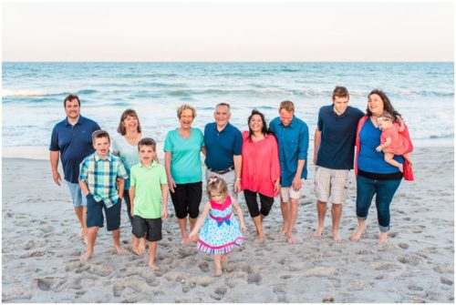 family walking with ocean in background during Melbourne Beach Family Photography session