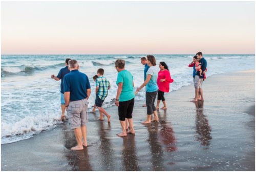 family playing by water during Melbourne Beach Family Photography session