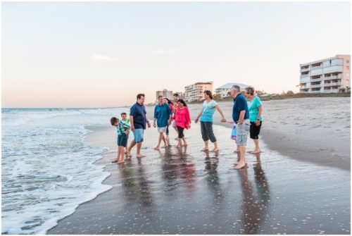 Family playing by water during Melbourne Beach Family Photography session
