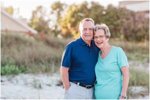 grandparents by dunes during Melbourne Beach Family Photography session