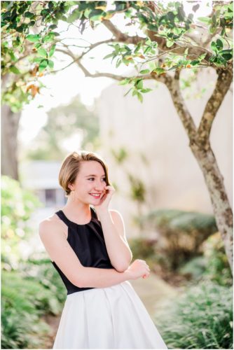 Girl standing on sidewalk during Sweet 16 portraits in downtown Eau Gallie