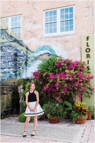 Girl by bird mural during Sweet 16 portraits in downtown Eau Gallie