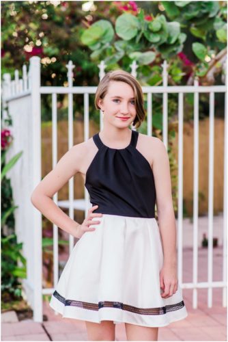 Girl with hand on hip during Sweet 16 portraits in downtown Eau Gallie