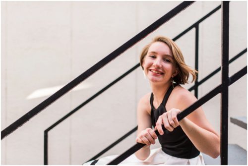 Girl on alley stairs during Sweet 16 portraits in downtown Eau Gallie