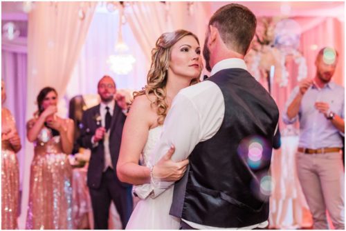 Bride and groom walking on dock at Crystal Ballroom Wedding